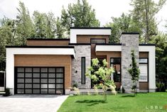 a modern house with two garages in the front yard