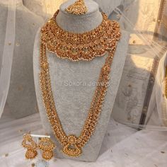 Luxury Bright gold polished champagne zircon full bridal set with small champagne pearl beads. Bridal set includes, Necklace, Long mala, Earrings and tikka This set is ready to ship as seen with gift box. Gold Kundan Sets For Reception, Gold Kundan Bridal Accessories For Reception, Gold Temple Jewelry Sets For Reception, Gold Temple Jewelry Bridal Accessories, Gold Bridal Accessories With Intricate Design For Marriage, Gold Bridal Sets For Reception And Diwali, Diwali Gold Lehenga With Intricate Design, Gold Temple Jewelry Bridal Accessories With Stone Work, Gold Sets With Tilla For Reception