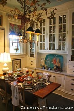 the dining room table is set for dinner