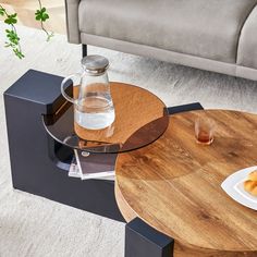 a table that has some food on top of it and a glass bottle next to it