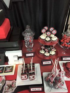 a table topped with lots of desserts and candies