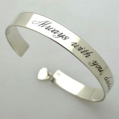 Personalized Sterling Silver cuff bracelet for her. This inspiration cuff comes with the heart charm. Personalize this message cuff up to 8-10 words. Meaningful birthday Gift for a Daughter. Stylish, fine personalized love bracelet, a custom accessory that offers a great way to emphasize her style! The shiny polished finish of the sterling silver cuff bracelet will be accentuated by the engraving featuring her name, a date, or a special message. The heart love charm will show her how much you ca Artistic Tattoos, Personalized Cuff Bracelets, Bracelet Message, Birthday Daughter, Locket Design, Bracelet Quotes, Sparkle Bracelet, Message Bracelet, Jewelry Styles