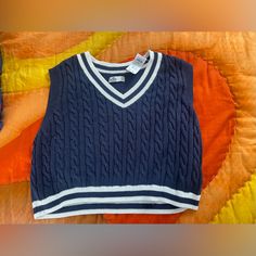 Nwt Navy Blue/White Hollister Sweater Vest Size L. Never Been Worn New With Tags Preppy Navy Tops For Spring, Preppy Navy Top For Spring, Preppy Navy Spring Top, Navy Cotton Casual Sweater Vest, Casual Navy Cotton Sweater Vest, Preppy Blue V-neck Top, Preppy Knit Tops For Spring, Blue V-neck Preppy Tops, Preppy Spring Knit Tops