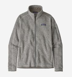 Patagonia Women's Better Sweater® Fleece Jacket in Birch White features warm 100% recycled polyester fleece dyed with a low-impact process that significantly reduces the use of dyestuffs, energy and water. Fair Trade Certified™ sewn. Front zipper has a wind flap and kissing-welt closure Raglan sleeves, princess seams on back and forward seams on front for contoured shape and fit Zippered handwarmer pockets; interior drop-in pockets Polyester jersey trim on wind flap, pockets, cuffs and hem Hip l Patagonia Better Sweater Jacket, Herren Style, Patagonia Sweater, Fleece Jacket Womens, Patagonia Better Sweater, Better Sweater, Clothing Manufacturer, Pull Sweat, Womens Fleece