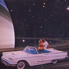 a man and woman standing on top of a white car in front of an image of saturn