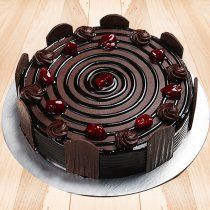 a chocolate cake sitting on top of a wooden table