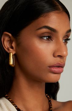 These square hoops in 22-karat-gold plate boast a handcrafted hammered finish for eye-catching texture and shine. 1 1/4" hoop diameter; 3/8" width Hinge with snap-post closure 22k-gold plate Imported Modern Hammered Hoop Earrings For Formal Events, Modern Hammered Hoop Earrings For Formal Occasions, Modern Gold Hammered Hoop Earrings, Luxury Hammered Gold Hoop Earrings, Luxury Gold Hammered Hoop Earrings, Contemporary Rectangular Gold Jewelry, Gold Hammered Hoop Earrings For Formal Occasions, Formal Gold Hammered Hoop Earrings, Formal Small Hoop Earrings With Hammered Detail