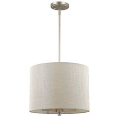 a light fixture with a beige shade on the bottom and white fabric covering around it