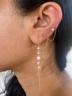 Pearls have been highly prized for all of history - it's said that Krishna plucked the first pearl from the ocean for his daughter to wear on her wedding. These pearls check all the boxes. They're modern, minimalist, classic, but also so beautiful that they'll take your breath away. These earrings are available in two styles - the standard extra long threader, and the double terminated threader. The standard threader has one end totally open and dangling, the other end threading through one or m Ocean Treasures, Best Friend Necklaces, Lobe Piercing, Peruvian Opal, Friend Necklaces, Blue Lace Agate, Threader Earrings, Herkimer Diamond, Jewelry Business