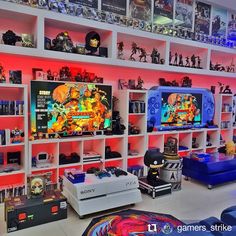 a room filled with lots of different types of video game equipment and games on shelves