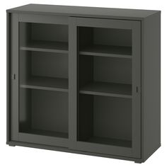 a gray cabinet with two doors and shelves