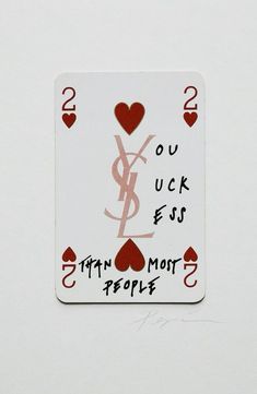 a playing card with the words you luck ess and two hearts in red on it