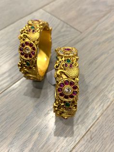 Temple bangle in matte gold and ruby stone. Detailing has the Rajasthani similarity. About an inch wide. Disclaimer: Price listed is for a single Kada. If you want to get them in a pair please select quantity 2. Ruby Stone, Matte Gold, Temple, Ruby, Bangles, Stone, Gold