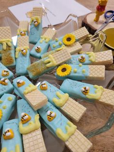 some waffles are decorated with yellow and blue frosting as the faces of bees