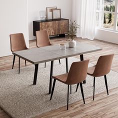 a dining room table with four chairs and a vase on the floor in front of it