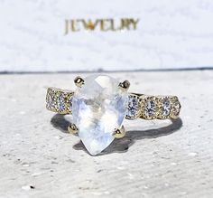 Don't miss this opportunity to own this beautiful gemstone ring crafted in 14k gold filled => Gemstone Type - Moonstone, Clear Quartz => Gemstone Cut - Faceted => Gemstone Size - 7*10 mm, 2.25 mm => Total Number of Gemstones - 9 => Metal Type - 14k Gold Filled (Tarnish Resistant And Nickel Free) - also available in 925 sterling silver * Please contact me for pricing on a sizes larger than 11 * ~ Feel free to ask me about custom made designs. ❏ Replacements and custom orders : ✪ 92 Pear-shaped Moonstone Gemstone Ring, Fine Jewelry Moonstone Pear-shaped Ring Gift, Teardrop Crystal Gemstone Promise Ring, Fine Jewelry Gift Moonstone Pear-shaped Ring, Fine Jewelry Gift: Pear-shaped Moonstone Ring, Teardrop Moonstone Birthstone Ring For Anniversary, Pear-shaped Moonstone Ring For Gift, Anniversary Pear-shaped Moonstone Ring, Engagement Ring Teardrop