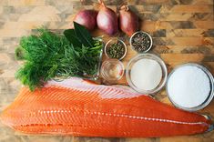 fish, spices and herbs on a cutting board