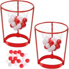 two red and white balls are in a basket with some sort of net on it