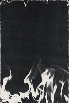 a black and white photo with flames coming out of it