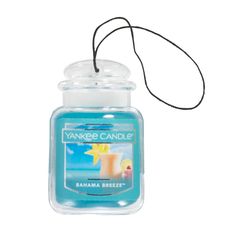 an yankee candle is shown in the shape of a glass jar with a string hanging from it