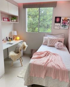 a bedroom with a bed, desk and window