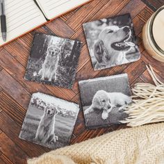 four pictures of dogs are placed on the floor next to a candle and some yarn