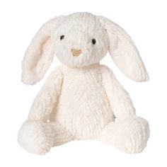 a white stuffed rabbit sitting up against a white background