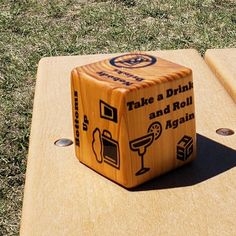 a wooden board game that is on the grass