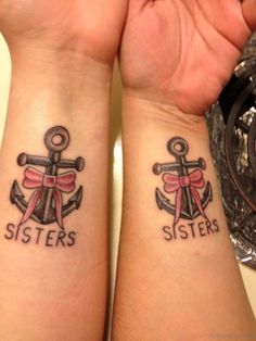 two people with matching tattoos on their wrists, one has an anchor and the other has