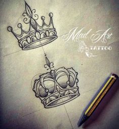 two crowns drawn on paper next to a pencil