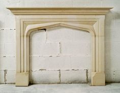 a white brick fireplace with an arch in the middle