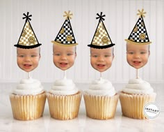 there are three cupcakes with hats on them and one has a baby's face