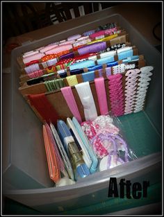 a container filled with lots of different colored toothbrushes