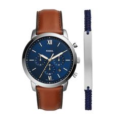 Enhance your everyday look with the classic design of this men's Fossil Neutra Chrono chronograph brown leather strap watch and bracelet set. The blue dial features luminous gold-toned hands, roman numeral and stick markers, a trio of chronograph sub-dials, and a date display. 44.0mm stainless steel case with mineral crystal Quartz movement keeps accurate time. The brown leather strap secures with a buckle clasp. Water resistant to 50 meters, this watch includes a 2-year limited manufacturer's w Watch And Bracelet Set, Fossil Watches For Men, Brown Leather Strap Watch, Mens Chronograph, Fossil Watch, Fossil Watches, Cord Bracelet, Leather Luggage, Brown Leather Strap