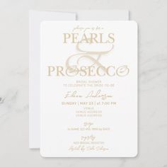 a white and gold wedding card with the words pearls and presecco on it