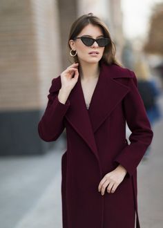 Introducing our wool wrap coat, a versatile choice for every season. This coat seamlessly blends style and practicality, making it a wardrobe essential. Featuring two functional pockets and a waist-accentuating belt, this coat offers convenience and a flattering fit. Crafted from luxurious Italian wool in a beautiful burgundy shade, it provides both comfort and warmth. IIf you want us to make this coat warmer, suitable for below -5oC, PM us, and we will reply you as soon as possible. Wrap style Regular fit Two pockets Big notch collar Belt Wool 100% Lining viscose 100%  SIZE All our clothes are made to order, so please allow 2 - 3 weeks for production. This time rate doesn't include the shipping time. EU      US         bust         waist         hips 34        2            80            6 Wedding Skirt Top, Burgundy Trench Coat, Silk Bridal Gown, Wool Wrap Coat, Cape Wedding Dress, Gown Skirt, Bridal Gowns Mermaid, Coat Autumn, Silk Wedding Dress