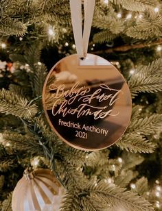 a christmas ornament hanging from the side of a tree