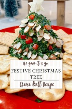 a christmas tree made out of crackers on a red plate with the words festive christmas tree cheese ball recipe