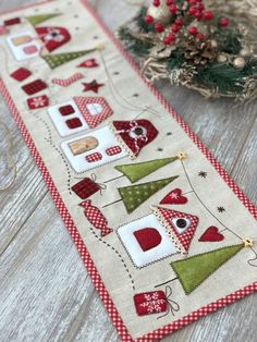 a table runner with christmas decorations on it