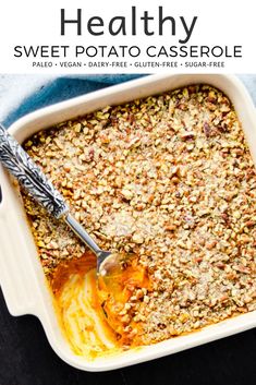 healthy sweet potato casserole recipe in a white dish with a serving spoon on the side