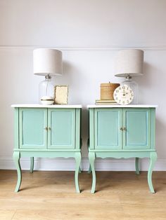 two nightstands with lamps on top of them next to each other