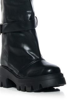 Your new go-to winter boot! The AZALEA WANG Marceline Bucket Black Faux Leather Bootie is made with a sleek vegan leather upper and features a mid-calf shaft height, an almond toe silhouette, a ridged flatform sole, tonal stitching, and an elasticated side slit panel for ideal stretch. Complete with a strappy belted accent, a faux silver metal buckle, and an easy pull-on fit. (all measurements are approximate from size 7.5) - Faux Leather Upper - Almond Toe - Mid-Calf Shaft Height - Ridged Flatform Sole - 2.5” Heel Height - 1.5” Sole Height - 9.25” Shaft Height - 14.25” Circumference - Imported Product ID: 380062 Azalea Wang, Leather Booties, Metal Buckles, Black Faux Leather, Mid Calf, Winter Boot, Black Denim, Metallic Silver, Vegan Leather