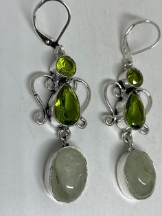 Delicate and detailed hand set Antique and Silver lever back earrings Genuine green peridot and Jade These dangle earrings are over an inch long Can be converted to clip ons. All jewelry is shipped free in the US in a nice gift box. Check out our over a THOUSAND great reviews Vintage Rainbow, Silver Dangle Earrings, Green Peridot, Silver Earrings Dangle, Antique Vintage, Lovely Gift, My Jewellery, Sterling Silver Rings, Jade