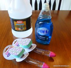 several cleaning products are sitting on a table