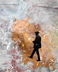 a man in a suit and hat walking across a painting covered ground with paint splatters