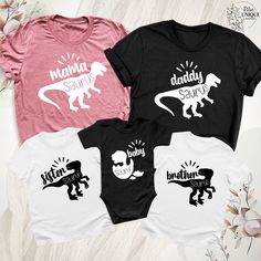 Dada Mama Baby Saurus Gift Shirt, Matching Family Saurus T-Shirt, Daddysaurus Shirt, Mamasaurus Dinosaur Mama Tee, Babysaurus Boys Girls Outfits, Fathers Day Mothers Day Christmas Tee, Dada Mama Mini Baby Shirts Outfits, Family Matching Shirt, Mommy and Me Shirts, Daddy and Me Tees, Mama Dada Mini Shirt, Mothers Day Shirt. Hello, Welcome to Blue Unique Boutique, your destination for unique and handcrafted shirts! I'm Eve! I have been thinking about creating my business for a long time and now I Cute Cotton Dinosaur Print T-shirt, Unisex White Top With Dinosaur Print, Unisex Dinosaur Print Crew Neck Top, Black Dinosaur Print Short Sleeve T-shirt, Black Short Sleeve T-shirt With Dinosaur Print, Family Matching White Dinosaur Print T-shirt, White Dinosaur Print T-shirt For Family Matching, White Family Matching T-shirt With Dinosaur Print, Family Matching White T-shirt With Dinosaur Print