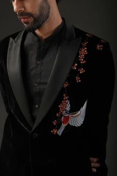 Black silk lined tuxedo with bird and floral resham embroidery.
Component: 1
Pattern: Embroidered
Type Of Work: Resham
Neckline: Notched Lapel
Sleeve Type: Full
Fabric: Silk Velvet, Lining: Silk
Color: Black
Other Details: 
Note: Pant and inner shirt worn by the model is not for sale
Occasion: Cocktail,Reception - Aza Fashions Designer Embroidered Tailored Tuxedo, Formal Embroidered Tailored Tuxedo, Formal Tailored Embroidered Tuxedo, Formal Tailored Blazer With Floral Embroidery, Tailored Floral Embroidered Blazer For Formal Occasions, Formal Embroidered Suit With Notch Lapel, Formal Embroidered Suits With Notch Lapel, Designer Embroidered Formal Suits, Designer Tailored Embroidered Suits