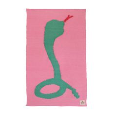 a pink rug with a green snake on it