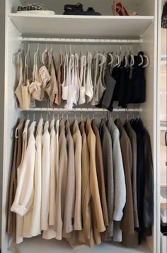 a closet filled with lots of clothes and shoes