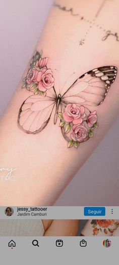 a butterfly tattoo with roses on the back of its wing, and an image of a woman's arm